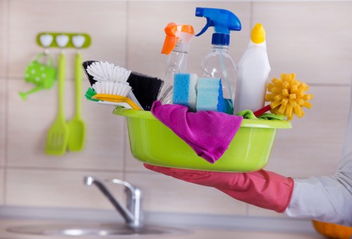 Carpet cleaner preparing equipment safely before work begins